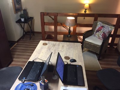 Added a side table with lamp, a rug & a cane chair with scatter cushion.